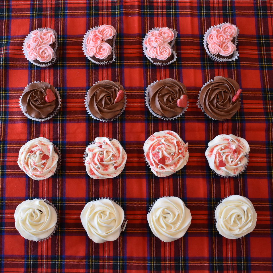 sixteen assorted valentines cupcakes arranged 4 by 4